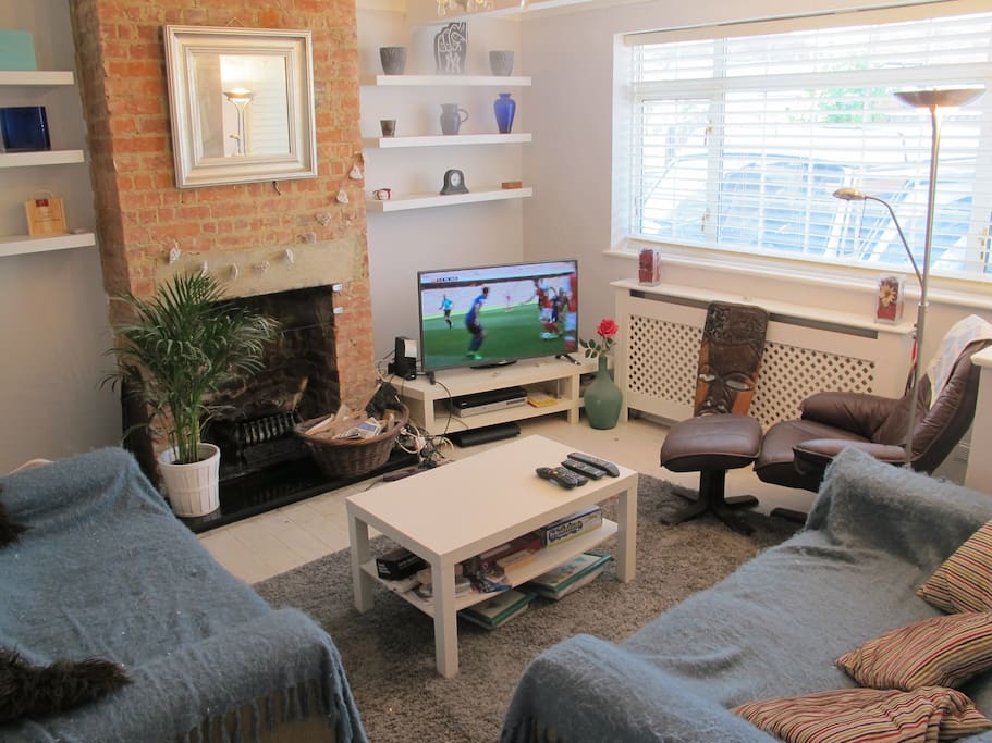 Lounge with twin sofas and armchair, 50" TV, Sky sports and movies, working fire place