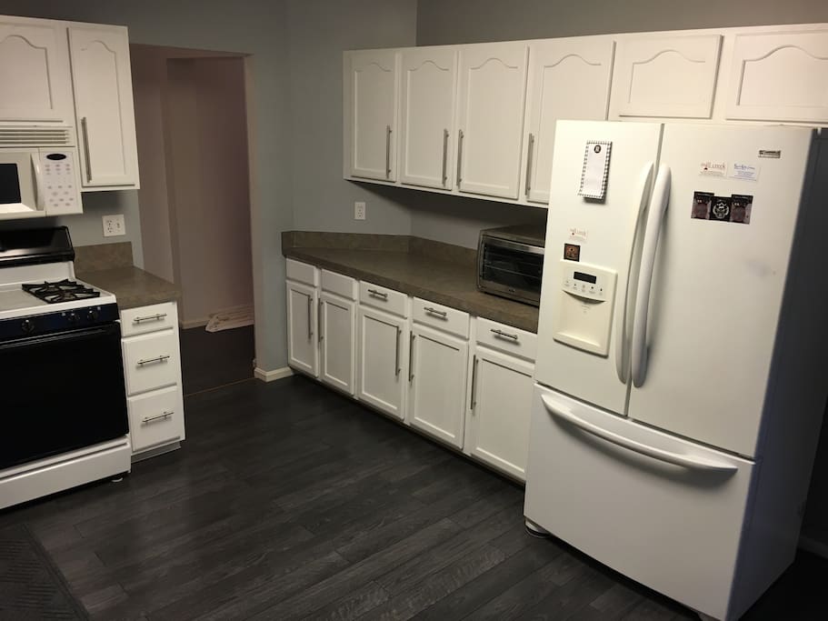 Kitchen with brand new modern floor and color scheme.