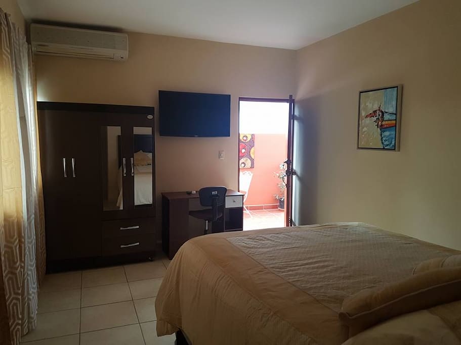 Room contains desk, wardrobe, Cable TV, Air Conditioner, Desk, and Complimentary Wi-Fi