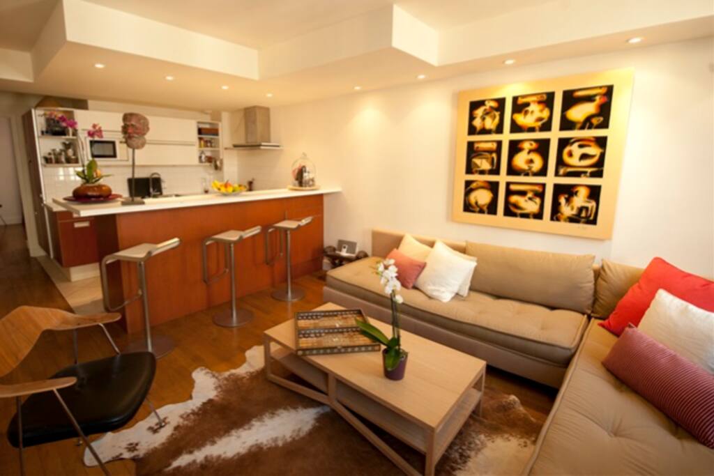 De-clutered open concept kitchen with barstools