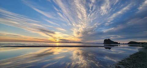 Steps from the Beach + Spectacular Mountain Views!