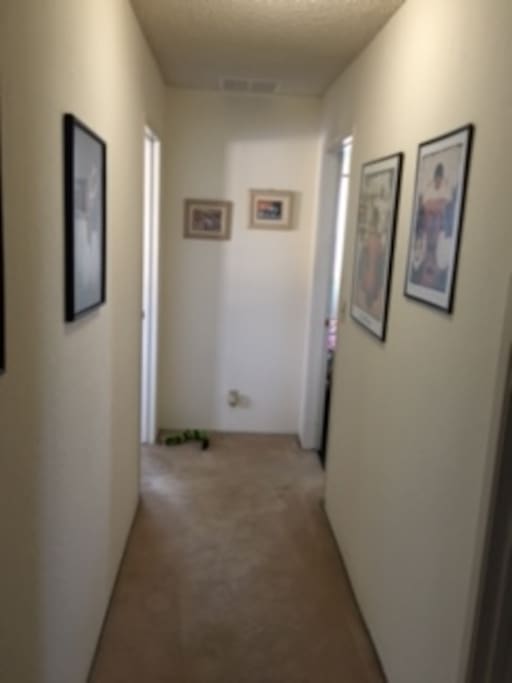 This photo shows the hallway between the two bedrooms,