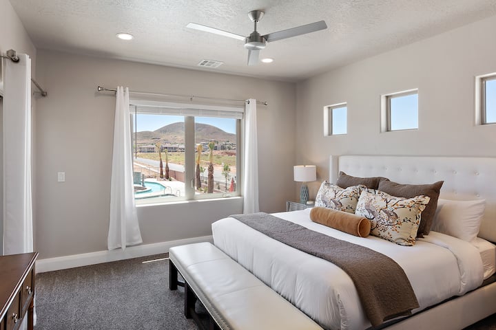 One of two upstairs master bedrooms.  Also with large screen TV, King sized bed and deck access.