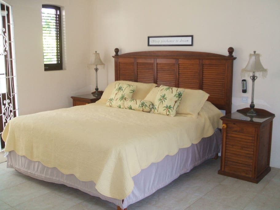 King Sized bed with gorgeous linens.