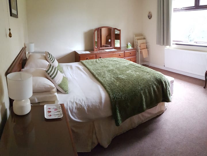 Master bedroom with King sized bed and fitted wardrobes