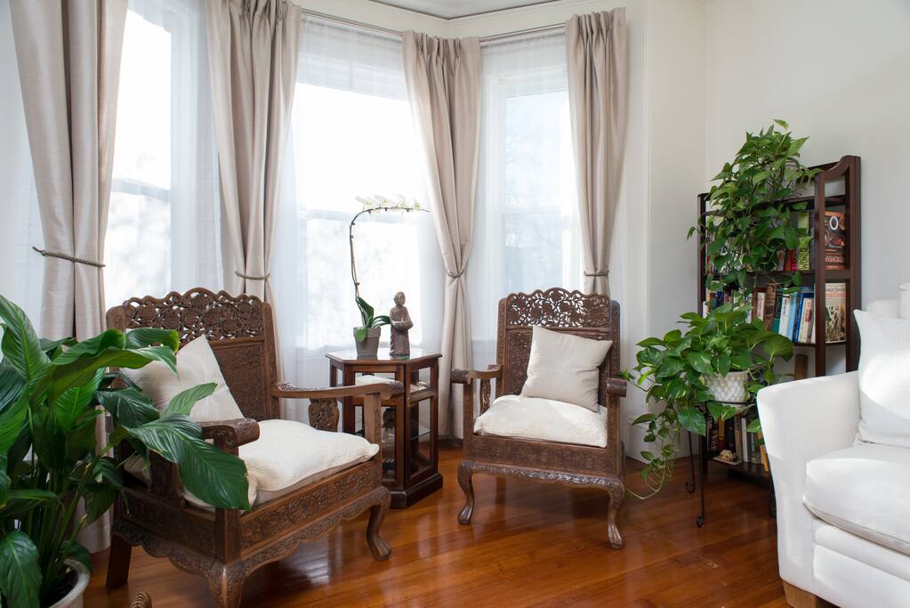 2nd Floor - Living Room with hand carved chairs.