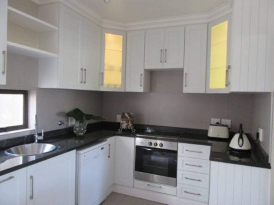 Kitchen with dishwasher, oven & microwave