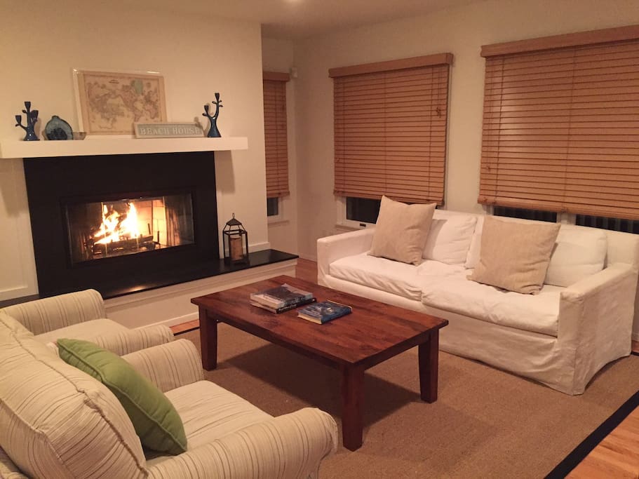 Cozy fireplace in one of two living room spaces.