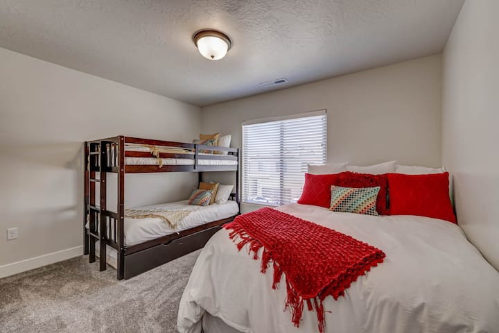 The third bedroom includes a queen size bed with luxury bedding and bunkbed with an additional floor trundle.
