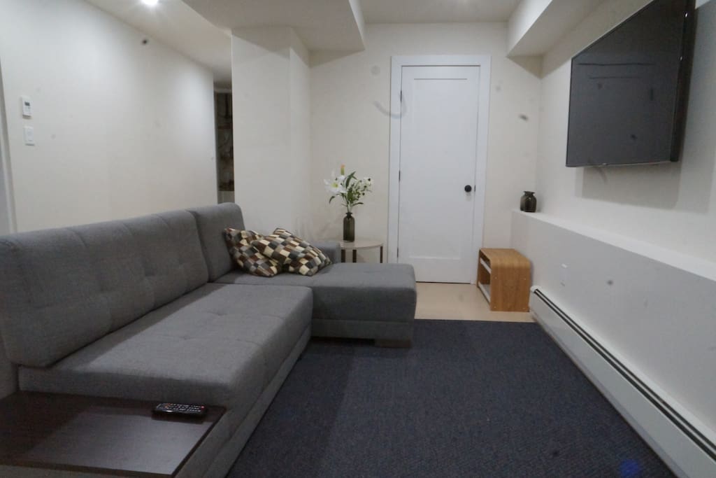 Seating area with large sofa bed for 2 people and 55" TV