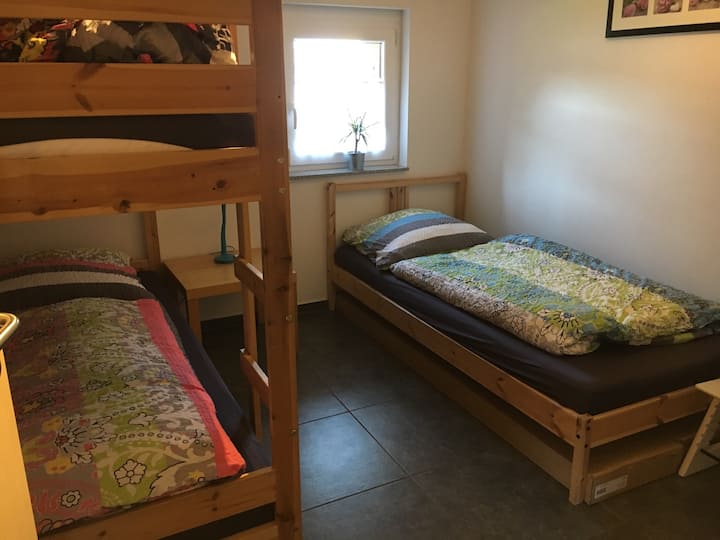 2nd bedroom with a high and a double bed