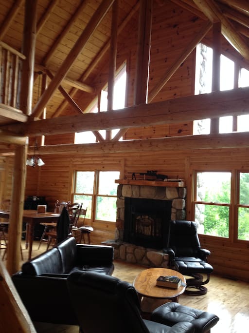 Large living room windows, fireplace