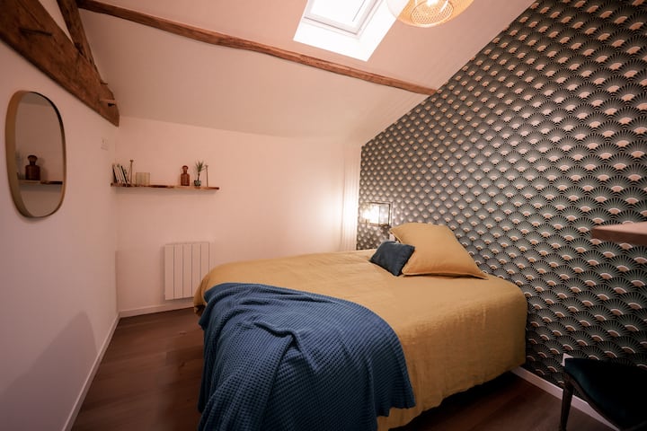 Warm Bedroom 4 welcomes you with its green and brass decor. 