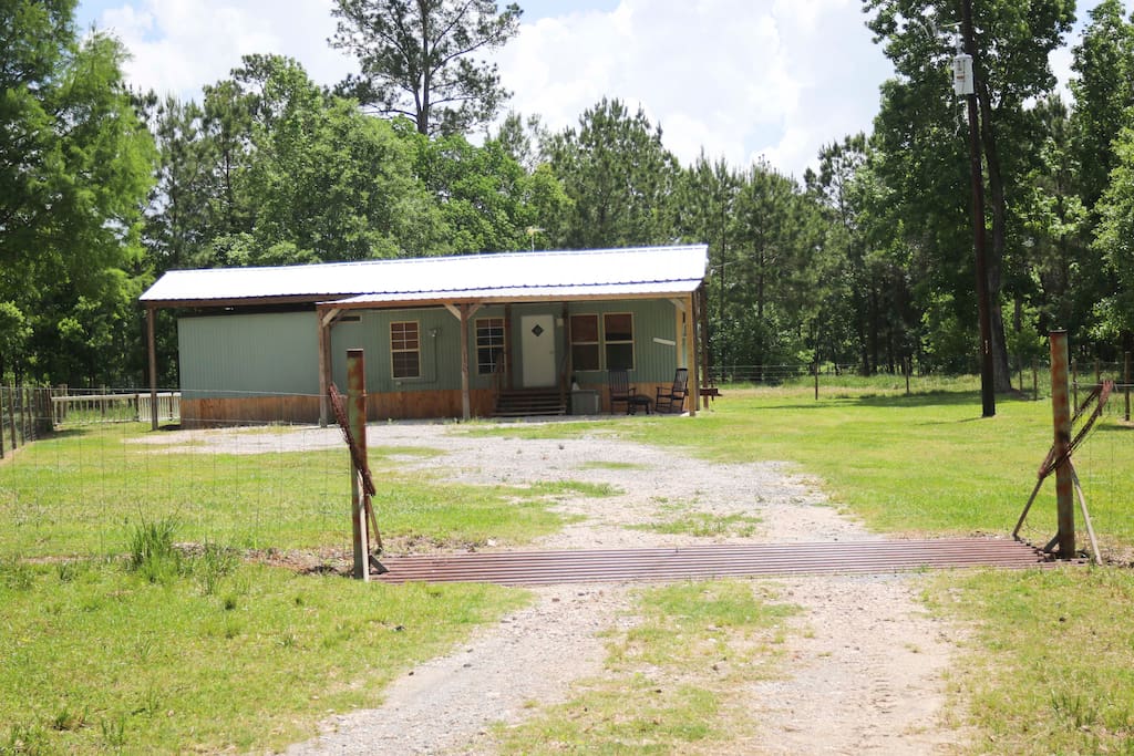 Carport and patio area to park and relax. Fenced in all the way except for cattle guard to keep the cows out!