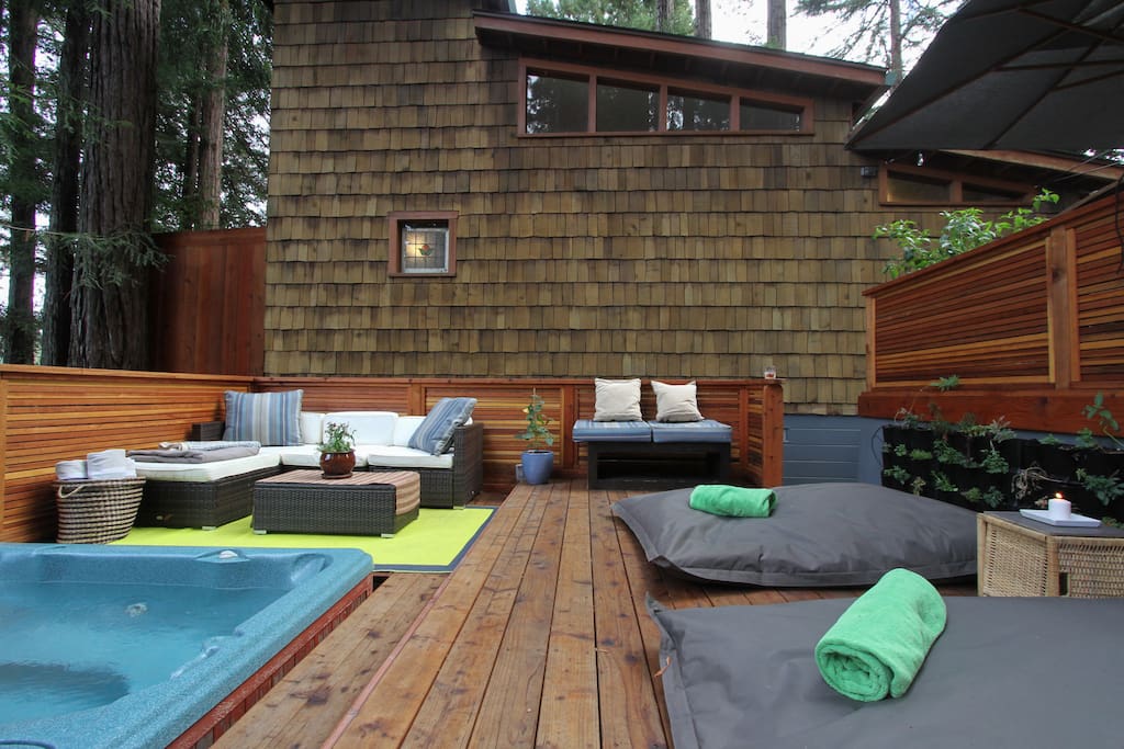 The hot tub with sofa's and 2 queen size bean bag chairs
on the back deck