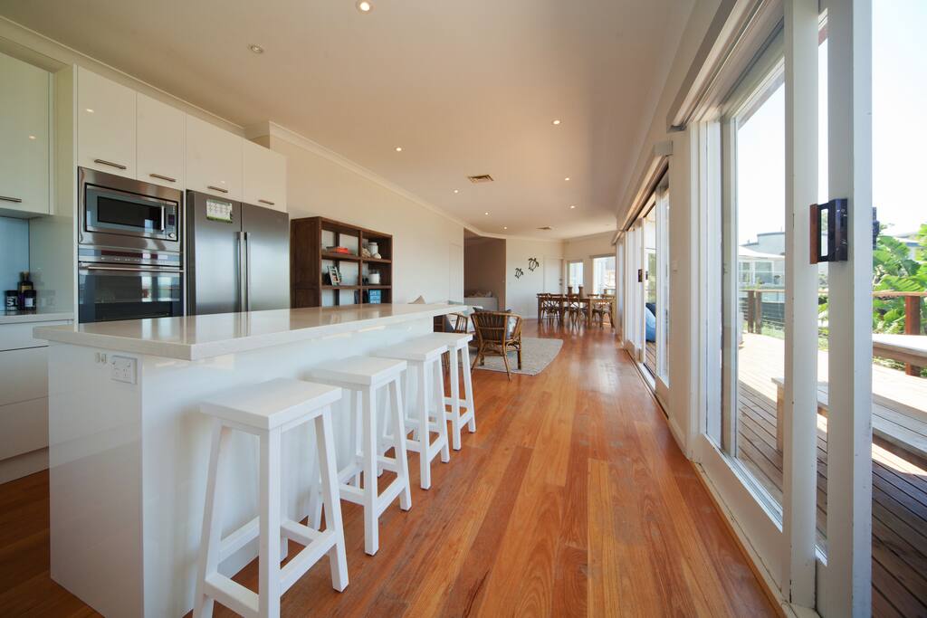 Upstairs open plan kitchen/ lounge/dining opening out onto deck