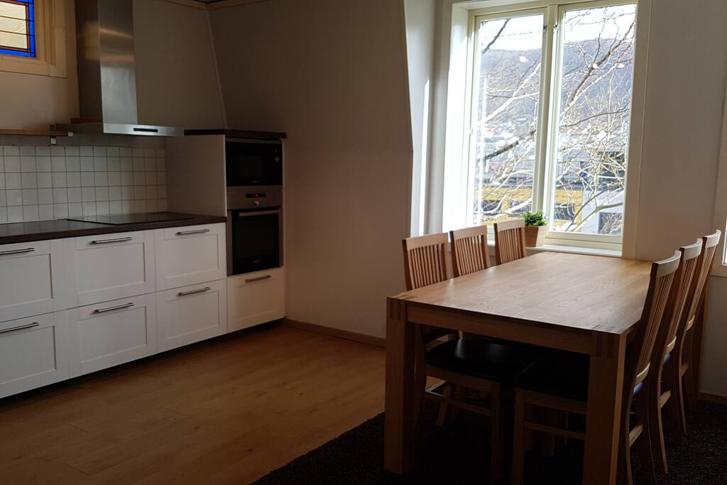 Kitchen with large, extendable dining table. Up to ten people can eat togther here.