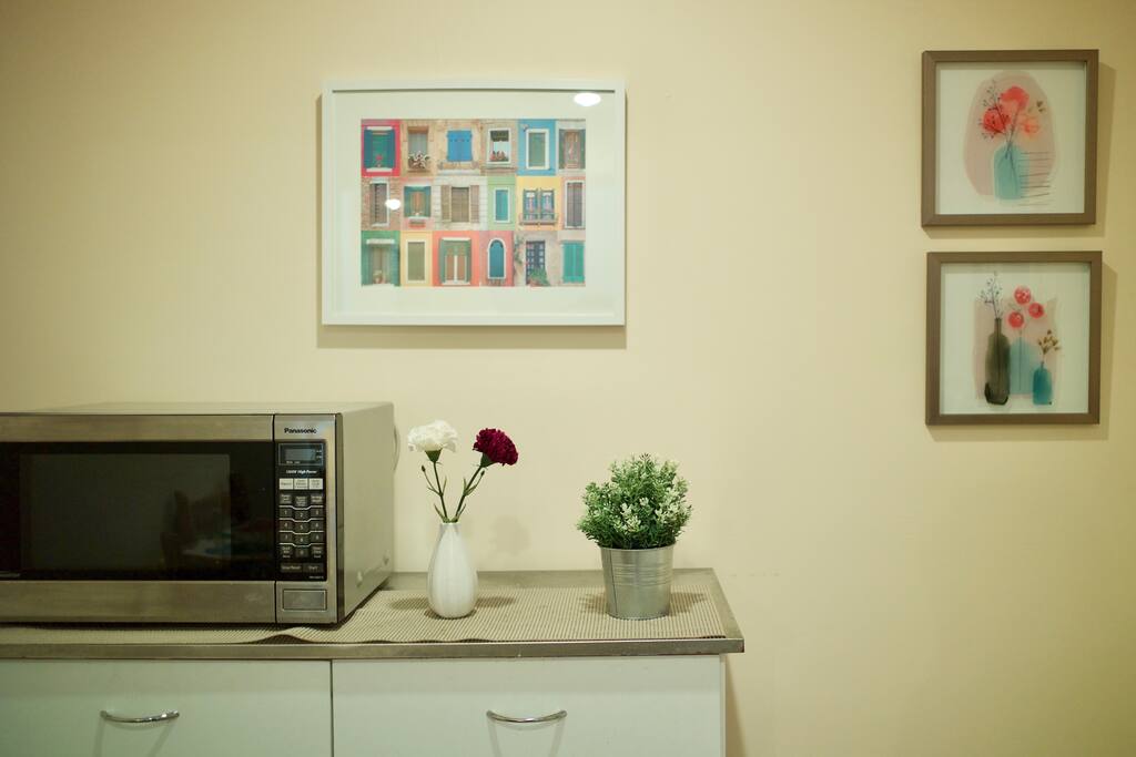 The Kitchenette is appointed with the basics; microwave, coffee maker, fridge, plates and utensils. Note, it's not a full kitchen and there's no stove.
