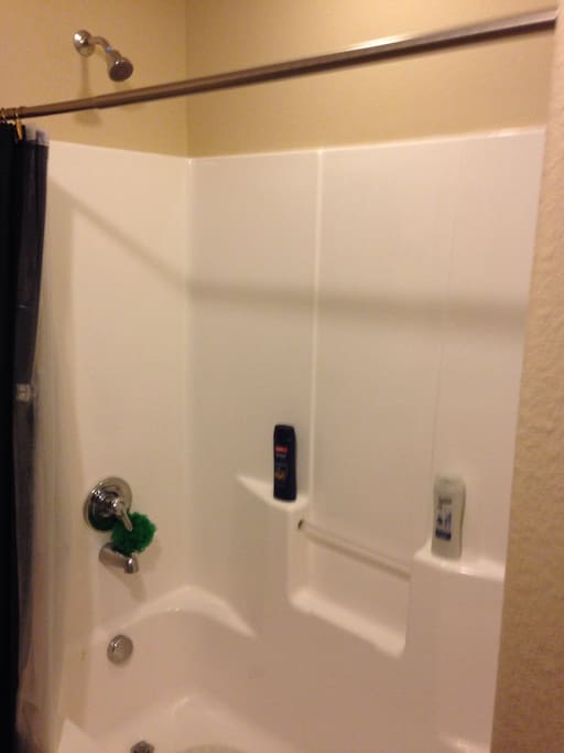 Shared upstairs bathroom with tub/shower combination.