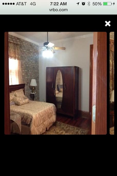 Queen size bed, hard wood flooring, crown molding, 160 year old non working fire place