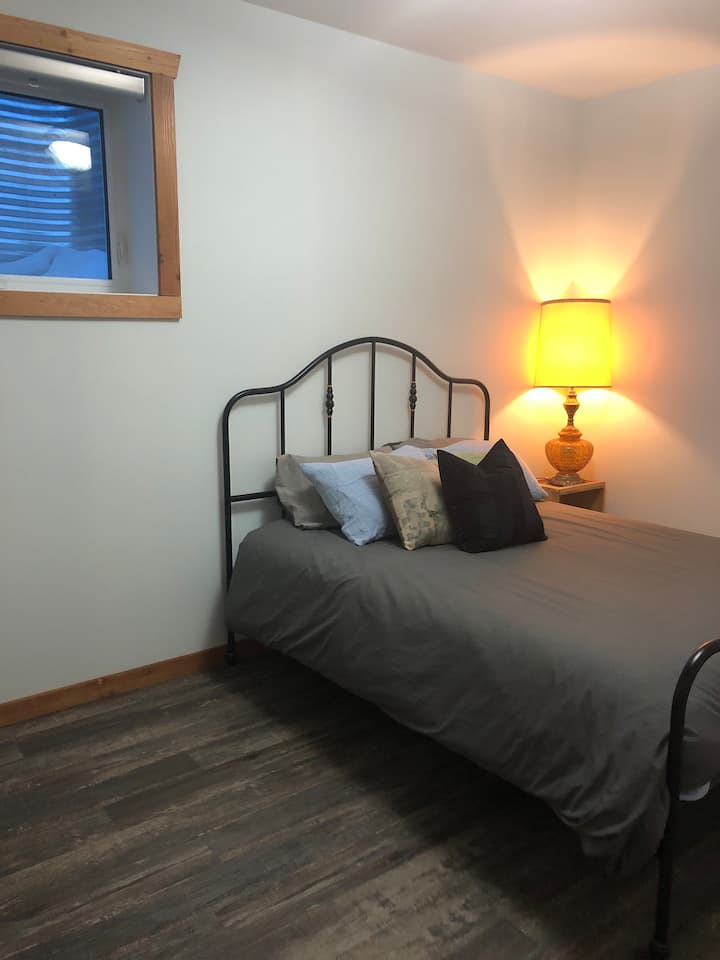 A generous queen bed.  A USB port to charge your devices.