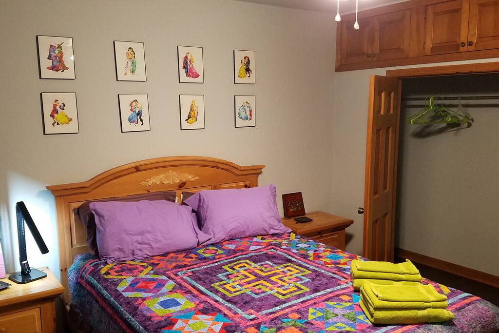 The Royal Room has a queen sized bed and a window. It also has a dresser and closet.