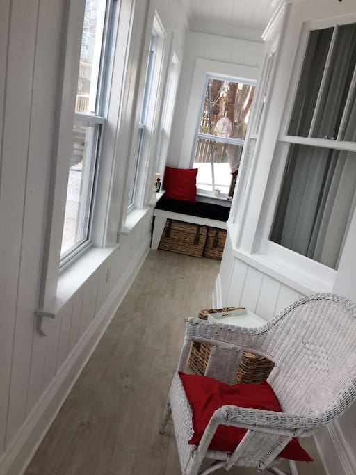 Entrance is a sun porch with built-in nook to curl up with a good book and cup of tea!