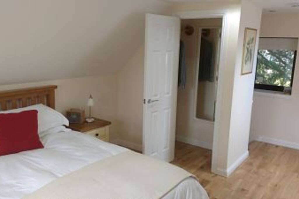 Bedroom with wardrobe and full length mirror