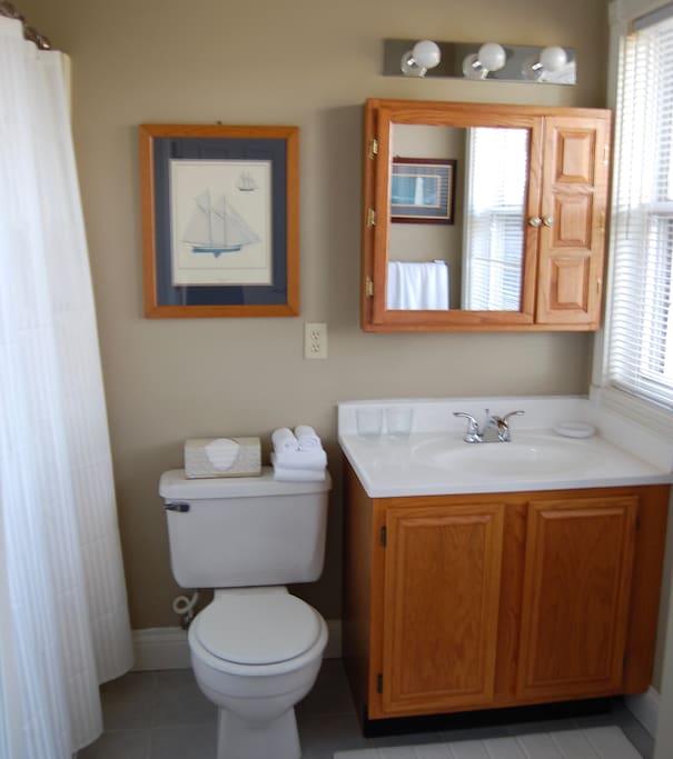 En suite bath with tub/shower unit.