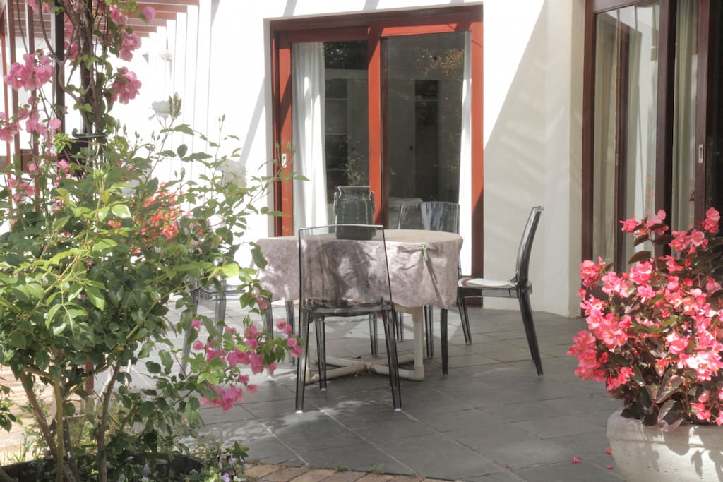 This is the patio off the main bedroom and lounge. There is a serving hatch to the kitchen through the patio sliding door.