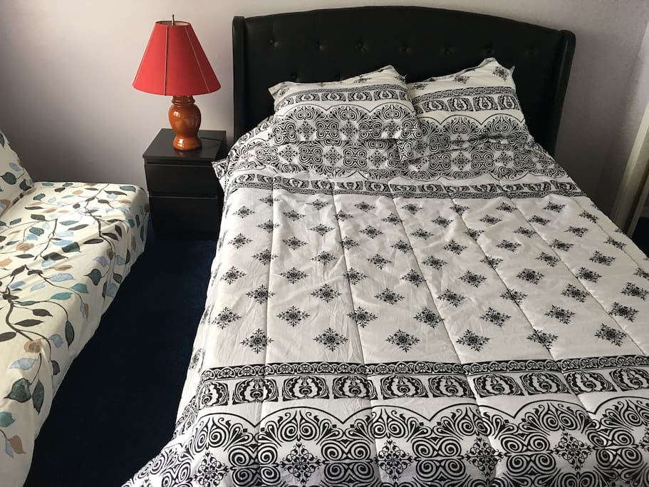 Room 2 has a queen size bed and 1 queen size sofa bed