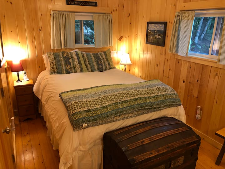 The bedroom has a queen-sized bed, and a door to the bathroom as well as a door to the Great Room.