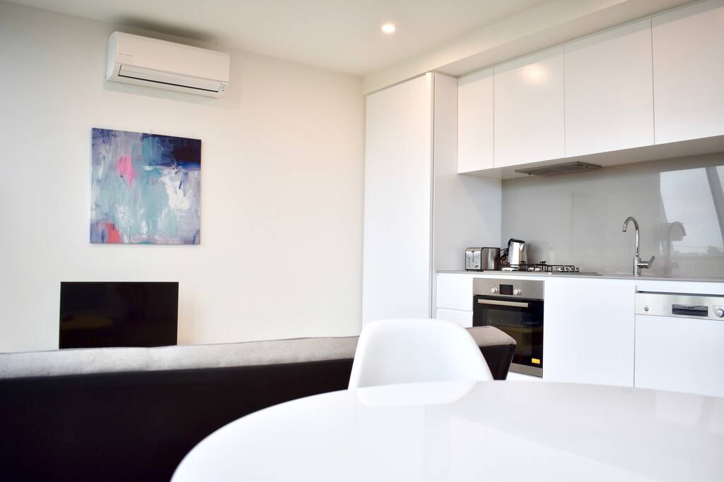 Large open plan living area with fully stocked kitchen