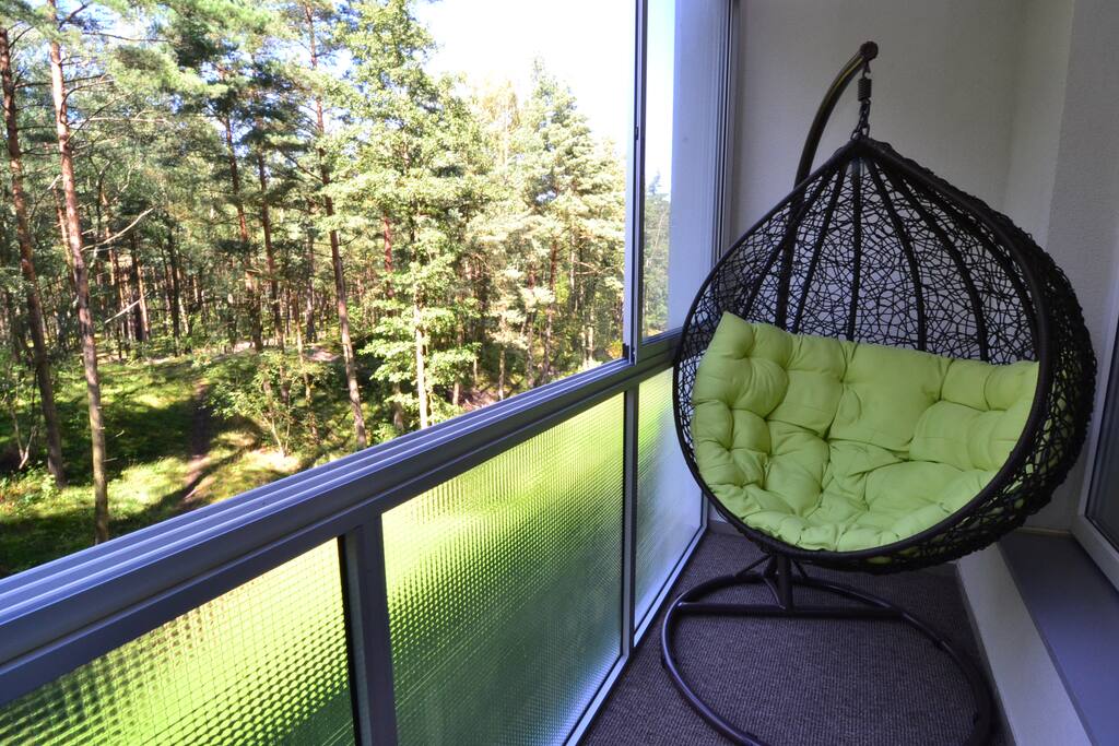 The spacious loggia with a view of the forest