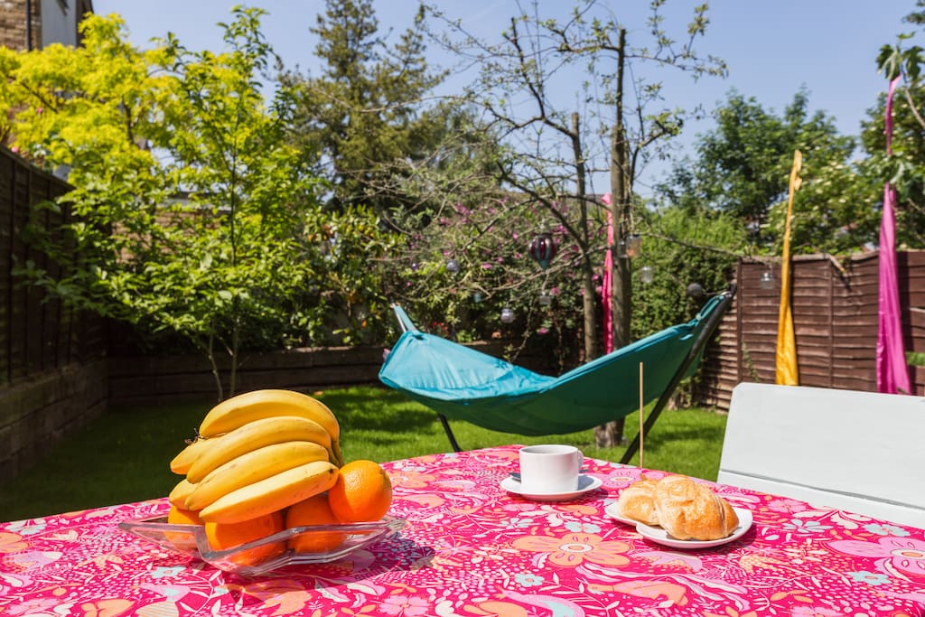 A help yourself breakfast of coffee, tea, pastries, fruit, cereal and yogurt