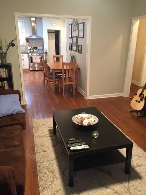 Spacious living room with open design leading to the kitchen. We have a Nest Thermostat which is easy to program.