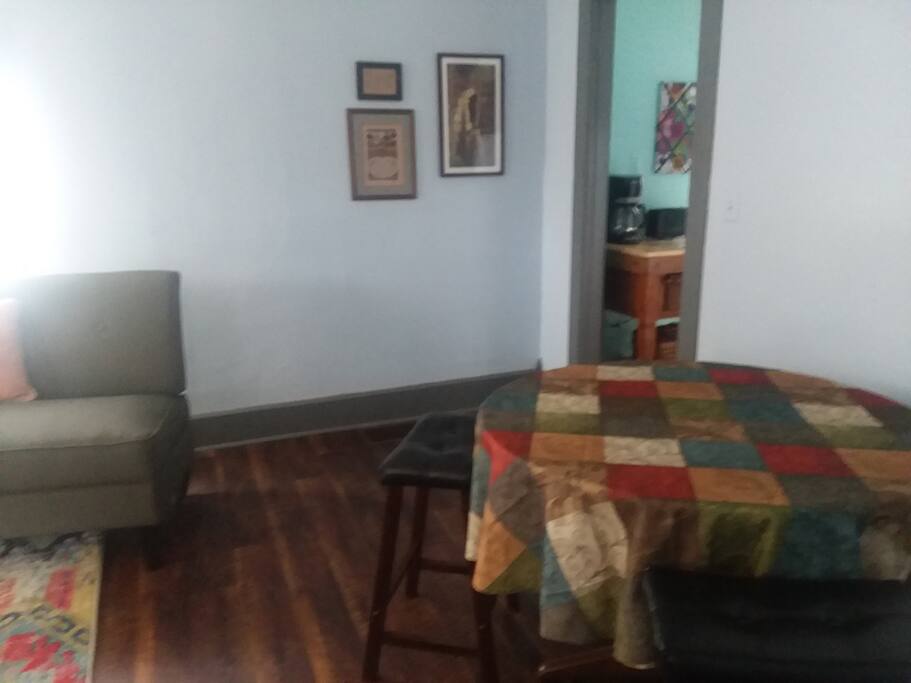 Table has saddle stools that can be tucked out of the way when not in use.