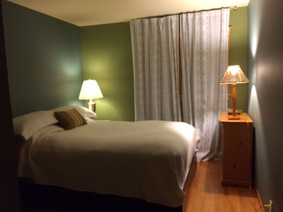 Queen bedding with pillowtop mattress and luxury linens.
