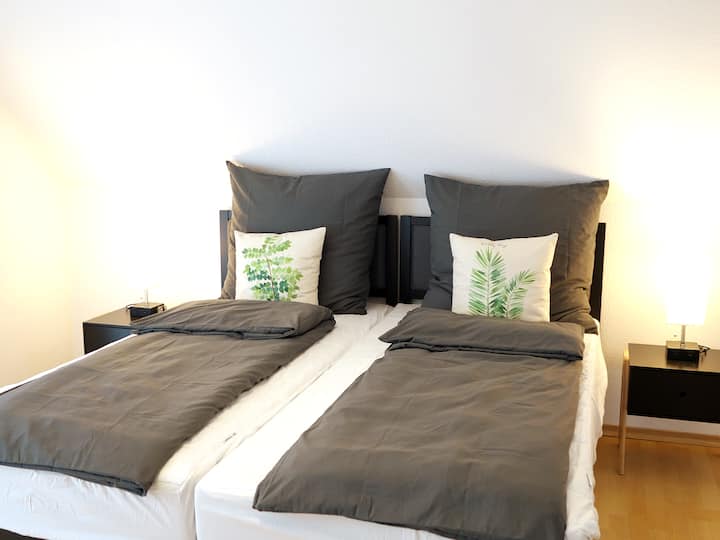 Bedroom 1 / a double bed topper (180X200cm) placed on two single beds