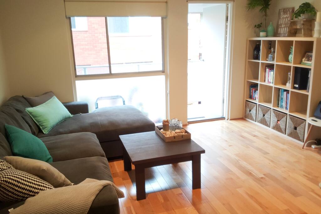Bright airy living room leading out to the balcony.