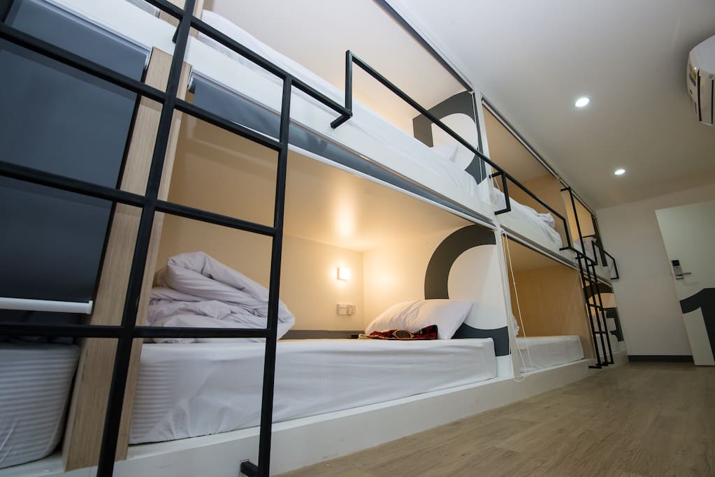 8 single beds in dormitory room