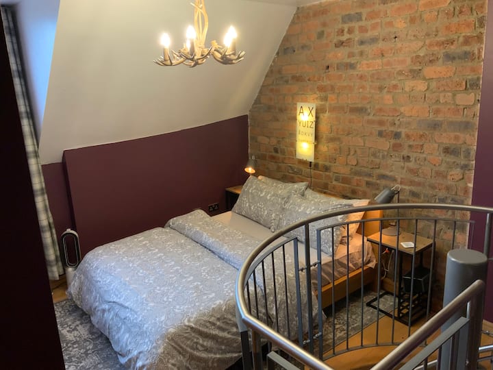 The bedroom on the top floor of the apartment.