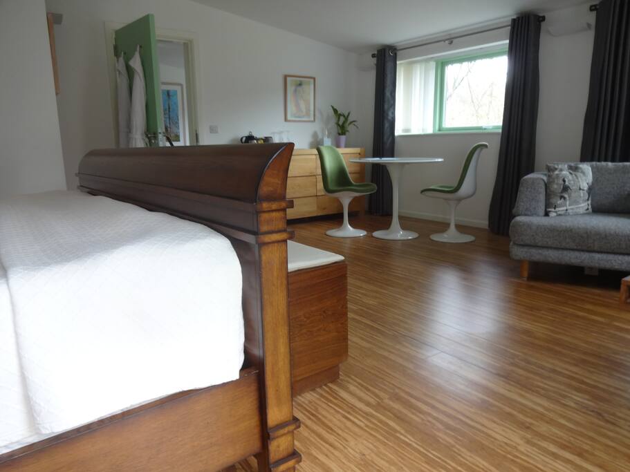 Room 1: Super King sized bed and view of dining area