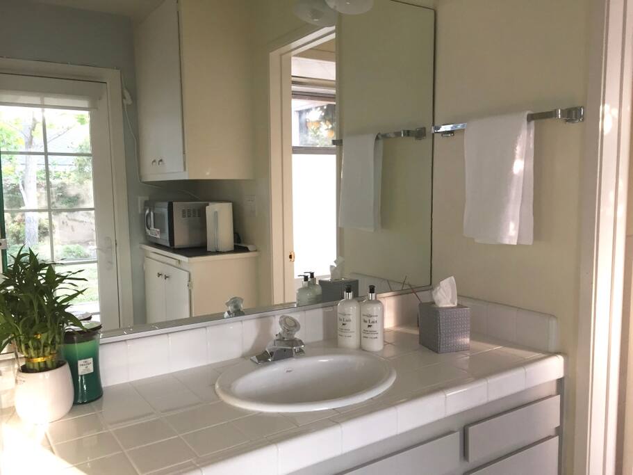 Vintage vanity, clean and fully stocked with all bathroom essentials.