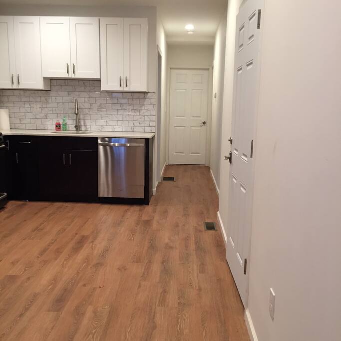 Hallway past the kitchen into the bathroom (left) and bedroom (straight ahead)