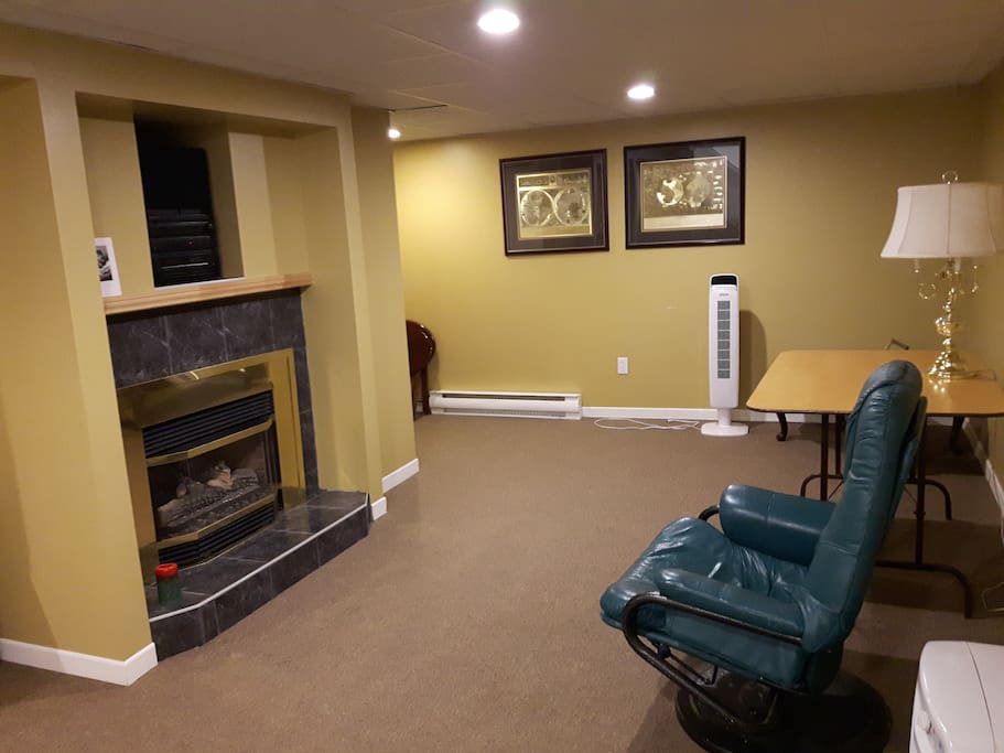 This is the living room downstairs which can be used by other clients. There is a nice fireplace.