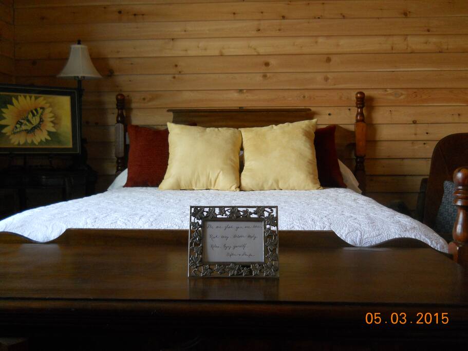 North bedroom - exterior style door for privacy and security; large window facing the farmland, rocking chairs, chest, crib if needed