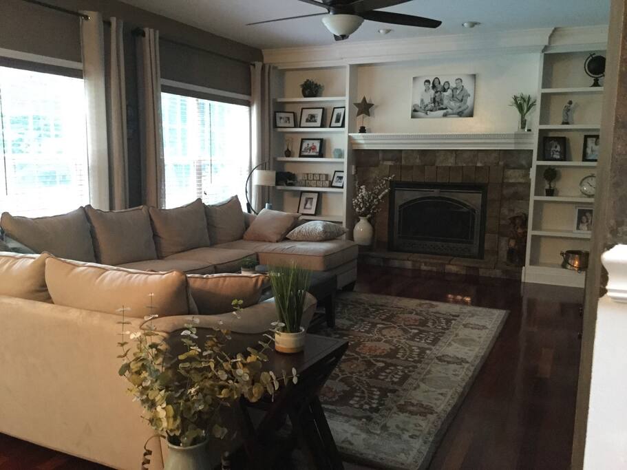 Large family room with a 65 inch curved TV