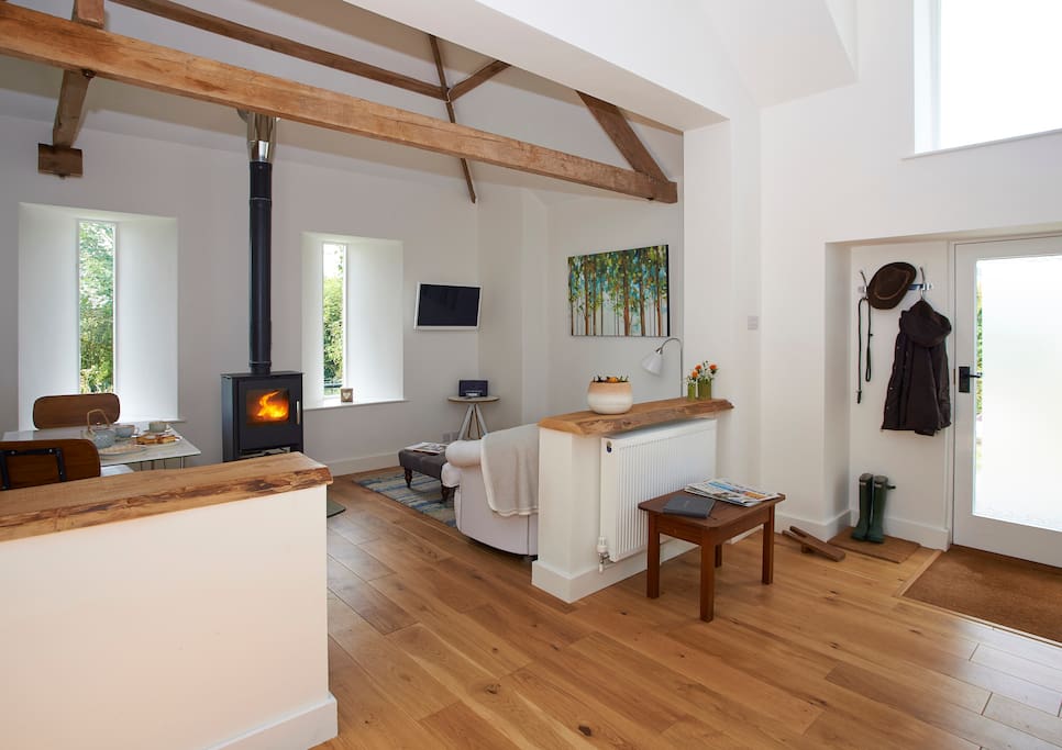 The main living room with wood burner and beautiful views to Cornwall.