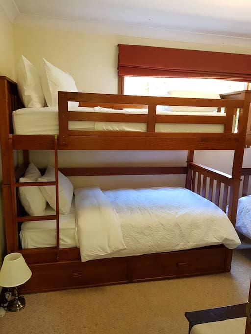 2 bunk beds with trundle bed. Sealy mattresses, fresh linens ( including sheets, quilt and towels) plus side tables with touch lamps.